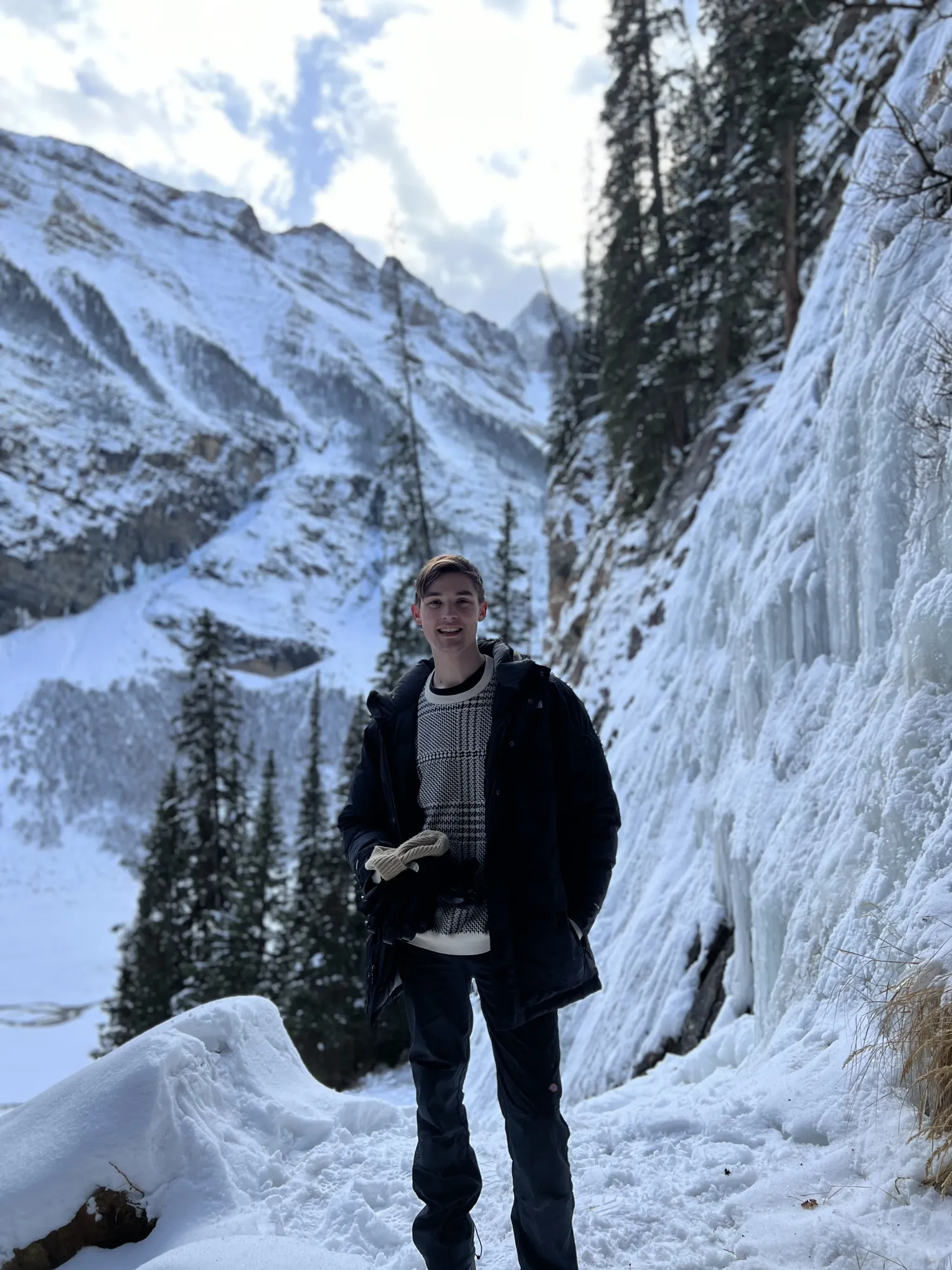 Ryan on the trail beside frozen waterfalls in Johnston Canyon, Banff