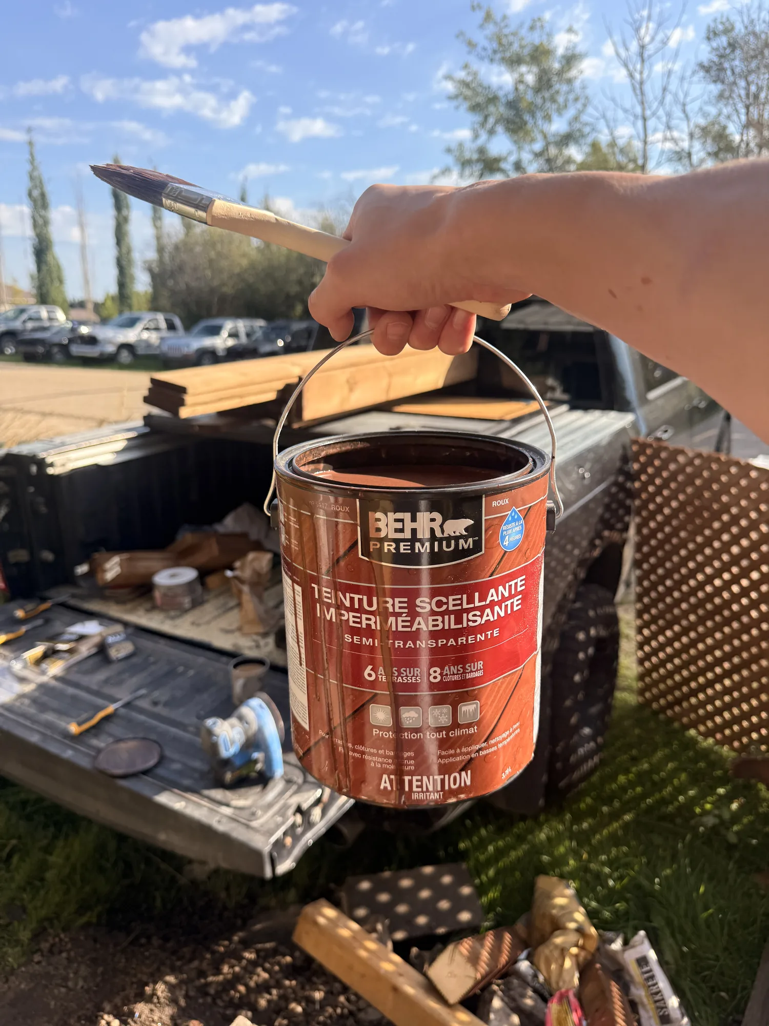 The tin of Behr semi-transparent waterproofing stain and sealer