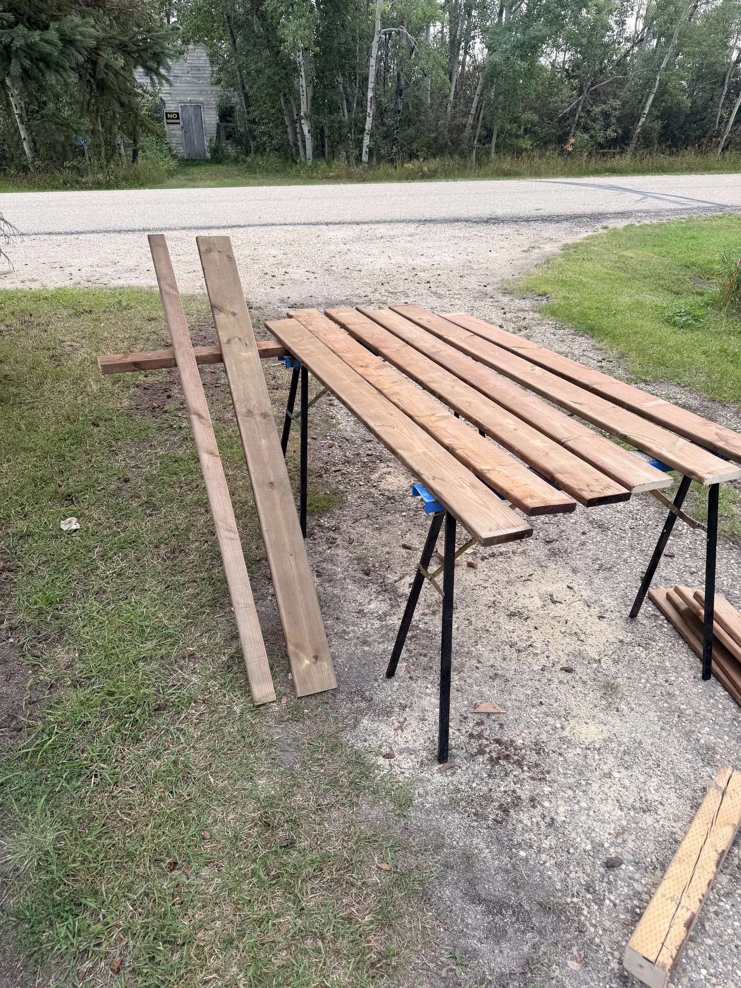 Stair boards laid across trestles ready for staining