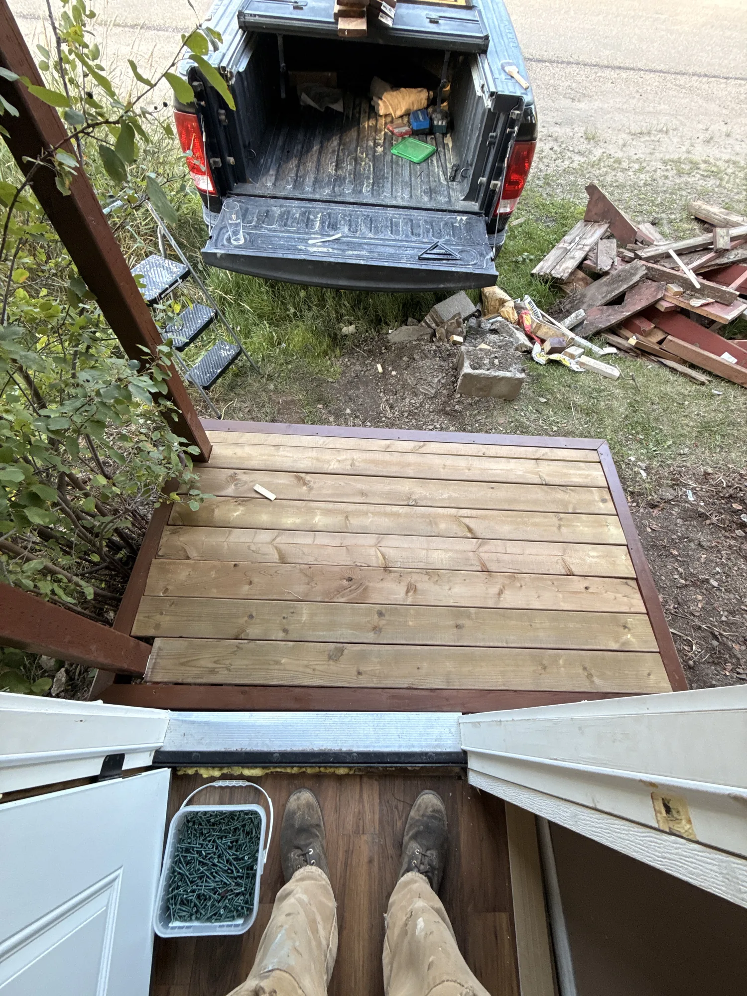 Decking boards going down, seen from the doorway