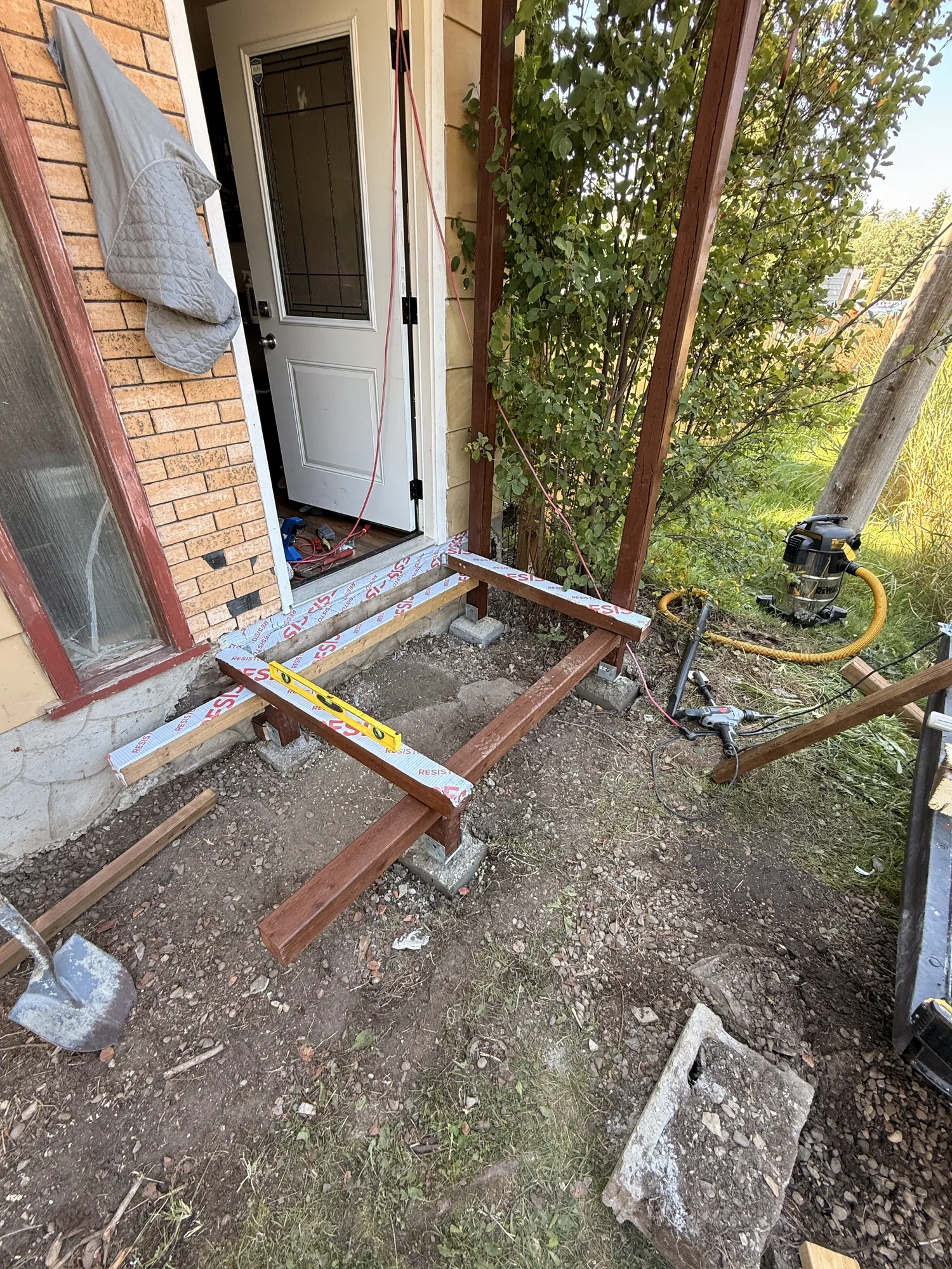 The outer frame going in, sitting on deck blocks