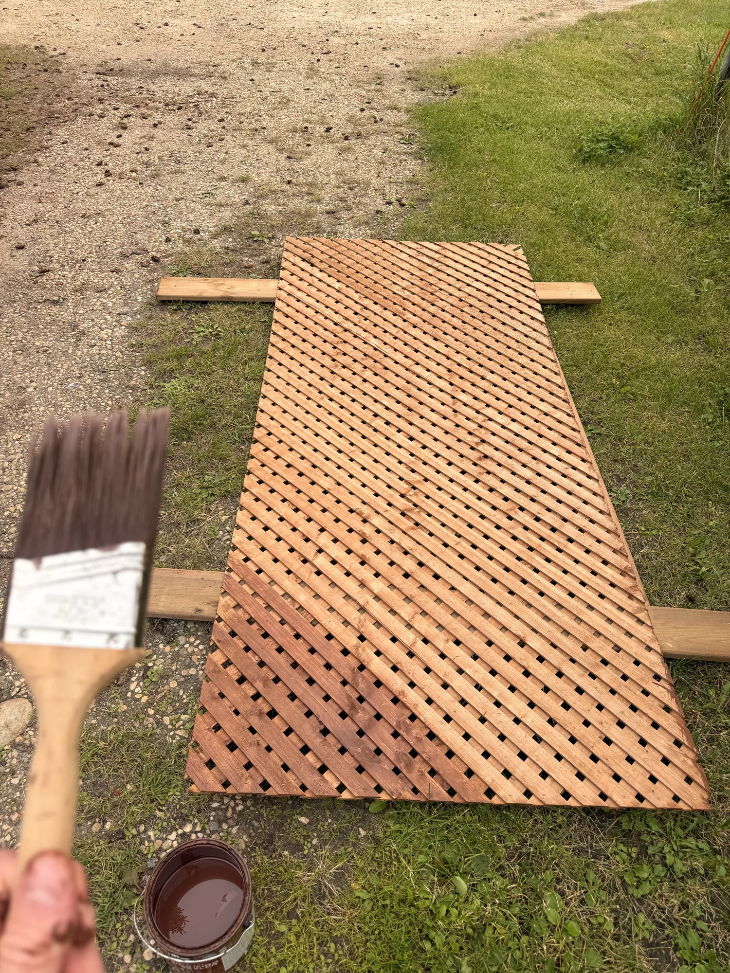 Brushing stain onto the lattice panel
