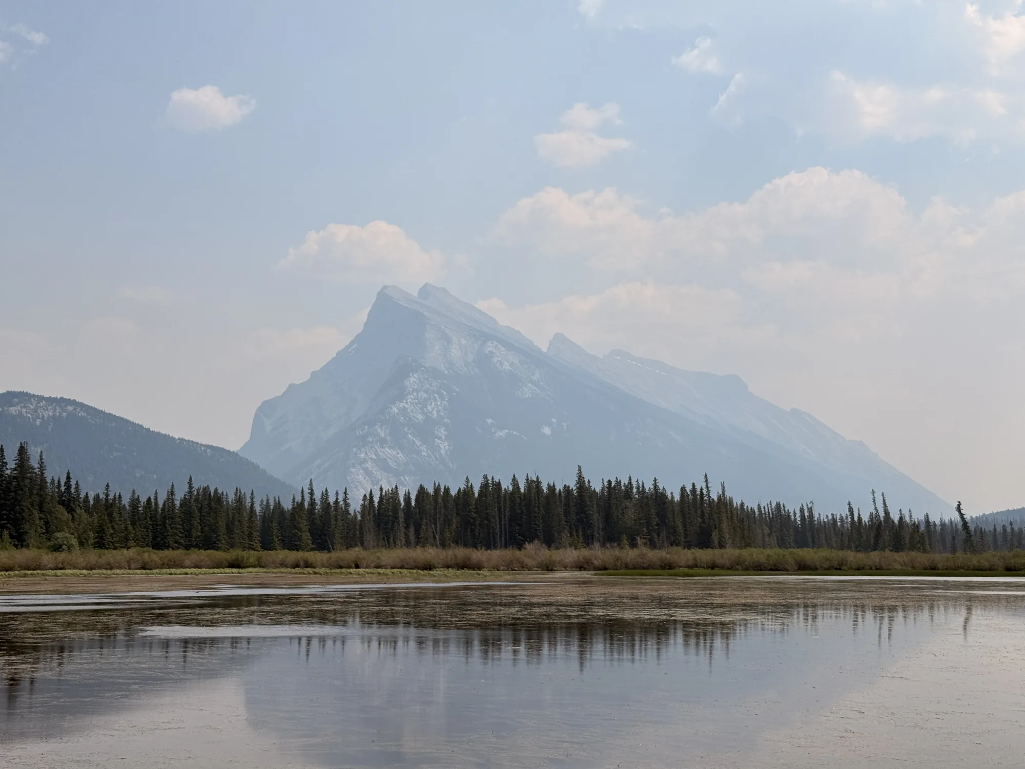 Mount Rundle reflected in the still water of the Vermilion Lakes