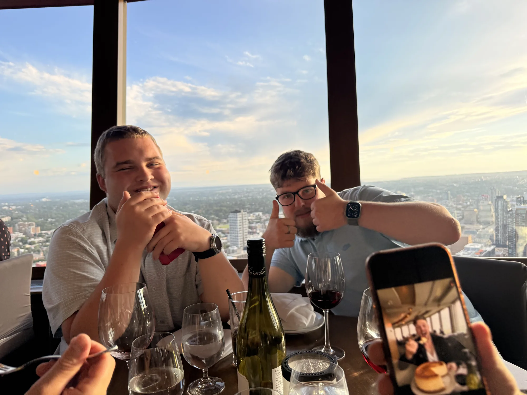 Dinner and wine high above Calgary at sunset