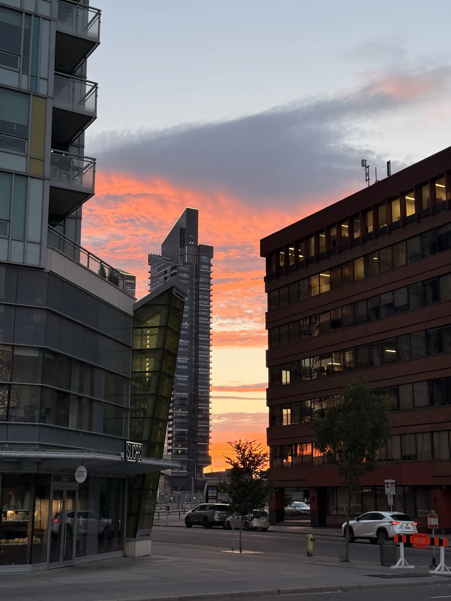 Orange sunset over downtown Calgary streets