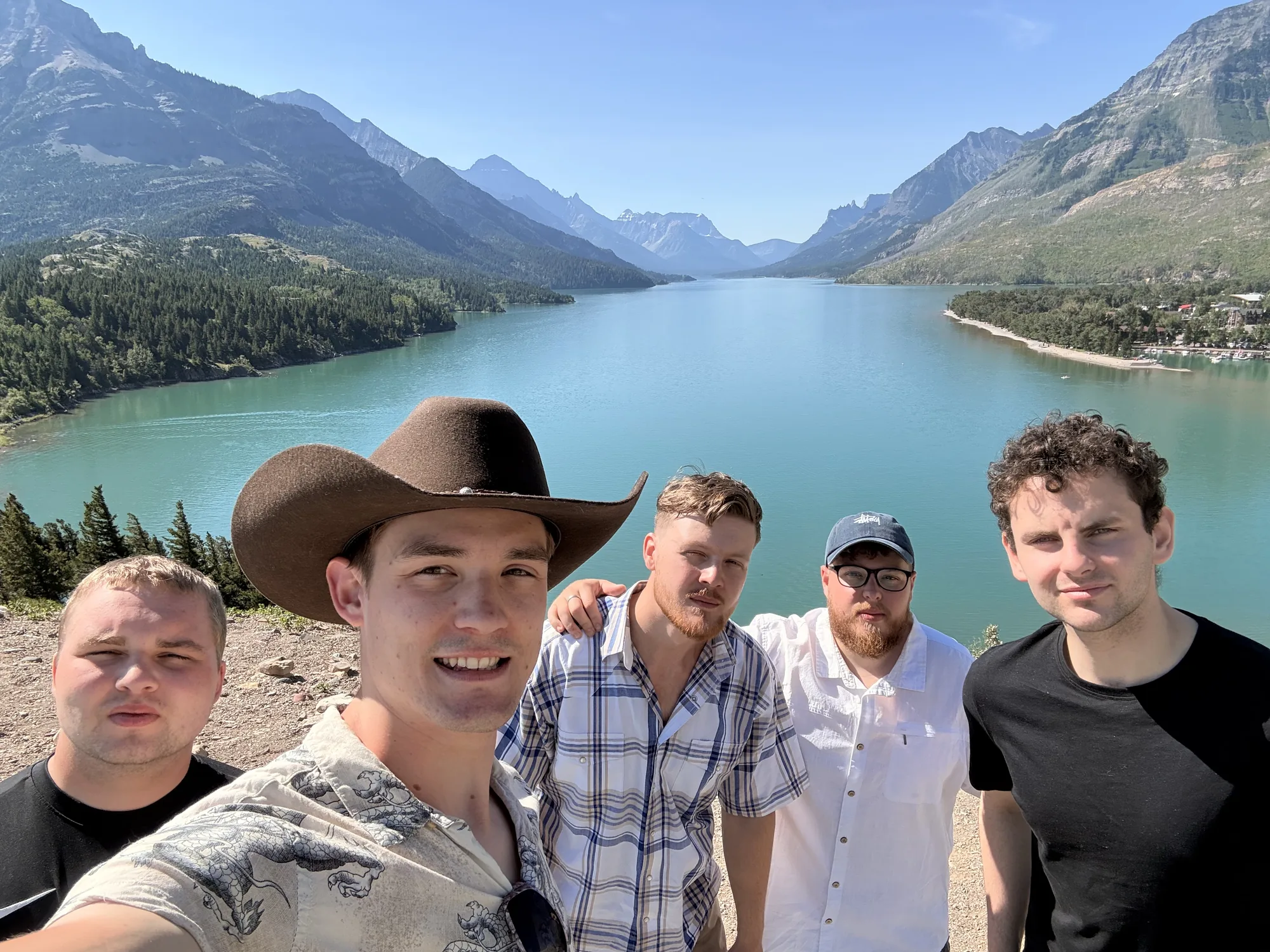 Five of us on the shore of Upper Waterton Lake with the mountains behind