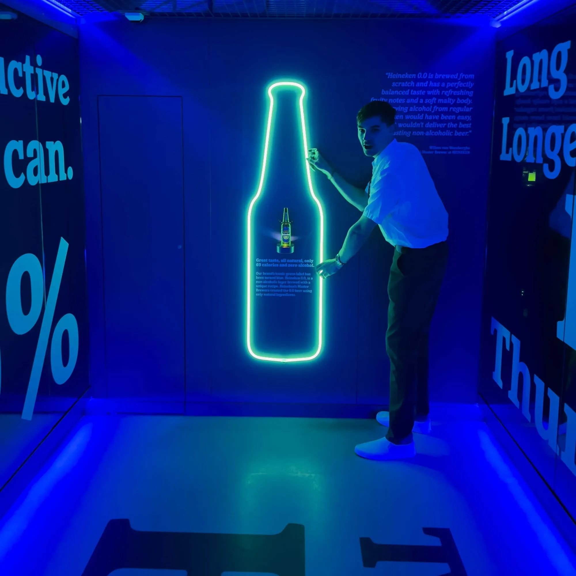 Ryan holding a large Heineken light