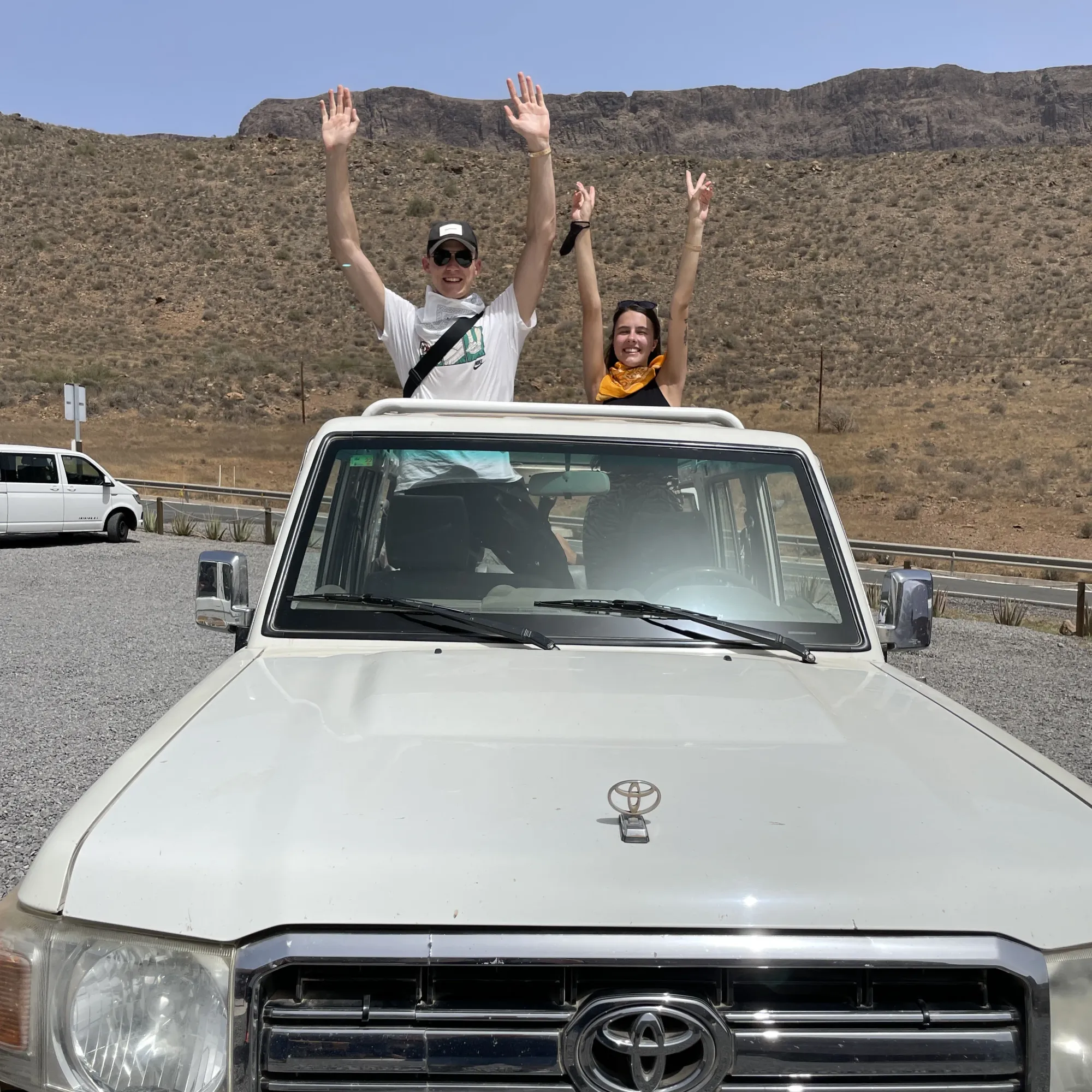 Coach parked with mountains behind on an island tour of Gran Canaria